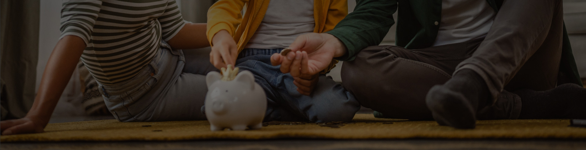 Family seated together and saving money