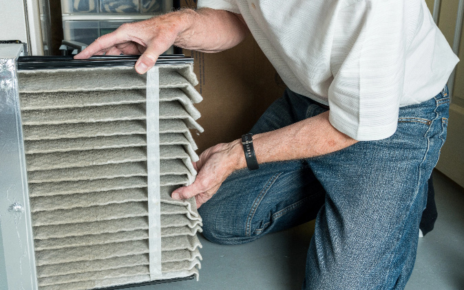 Man doing installation of filter