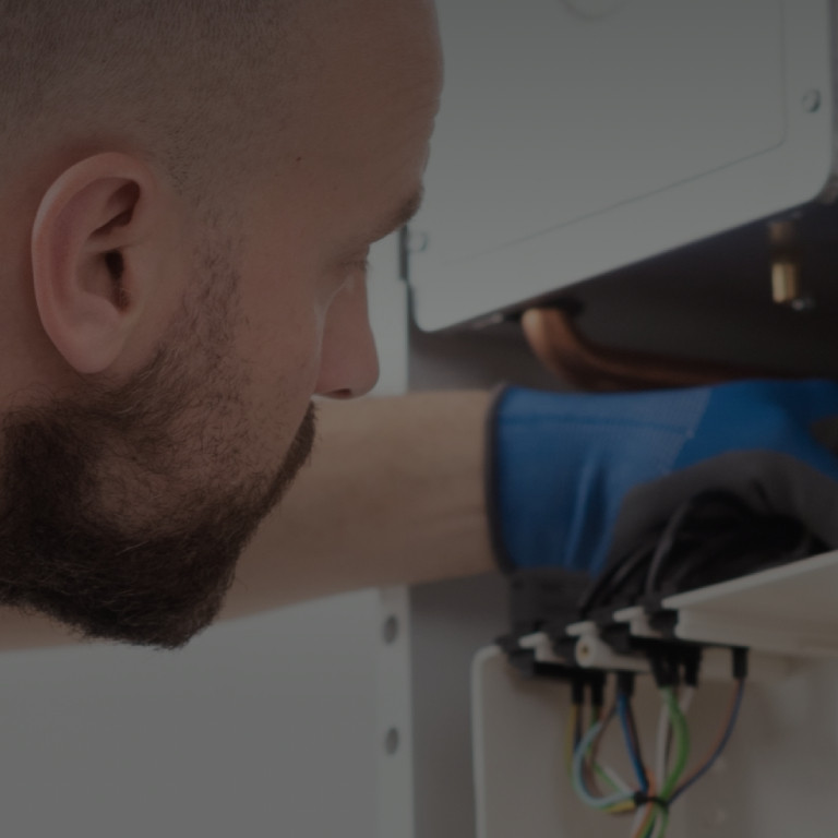 Man doing installation of heater at home