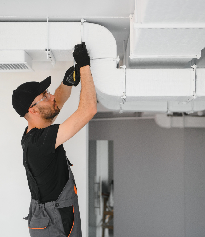 Man installing heater at home