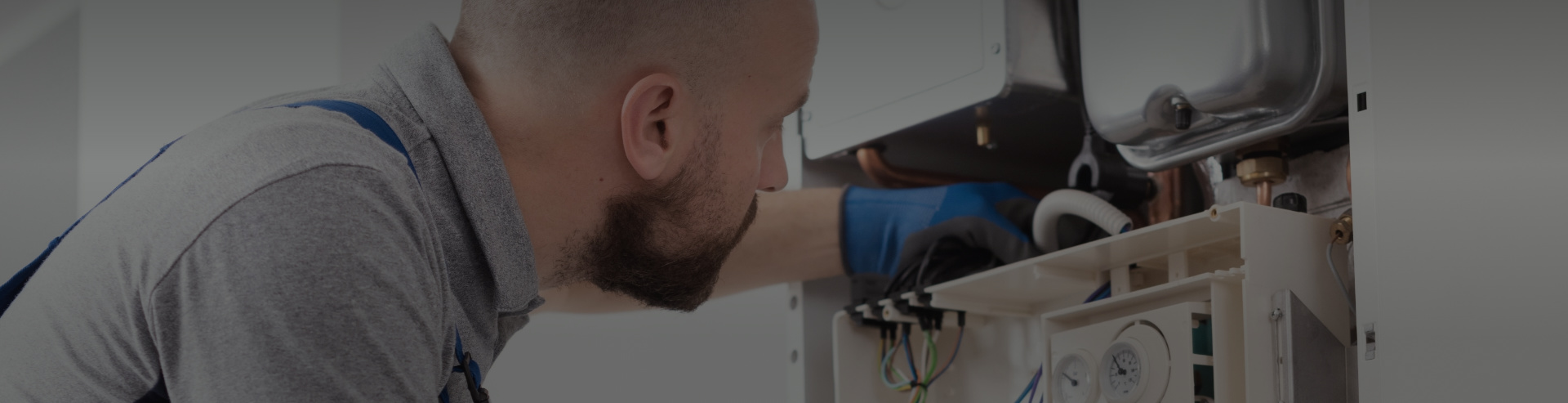 Man installing heater in building