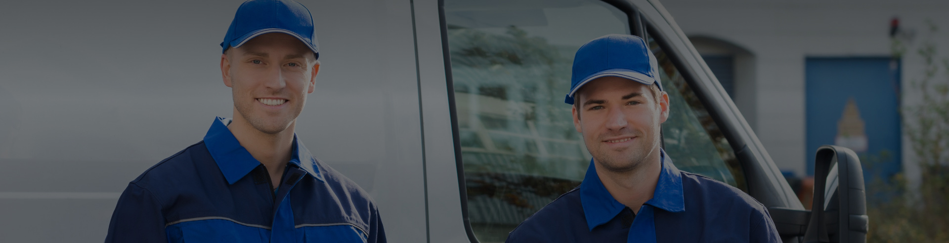 Two young men working and smiling