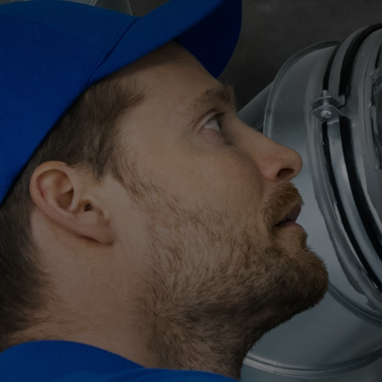 Man installing humidifier at building