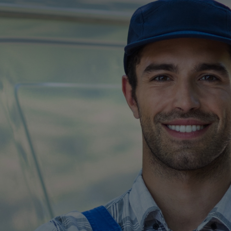 Man smiling uniform and cap