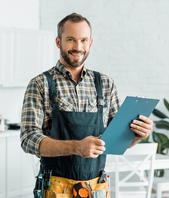 Man wearing uniform filling form