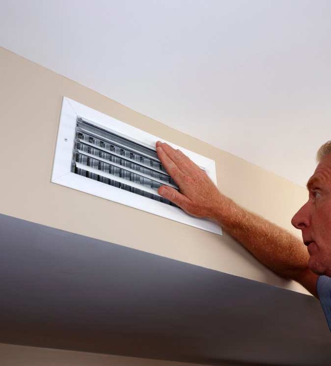 Senior man installing heater