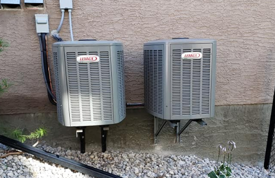 Two air conditioners outside home